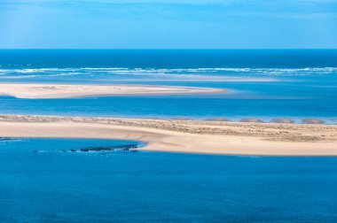 The Dune du Pilat of Arcachon in France, the highest sand dunes in Europe: paragliding, oyster cultivation, desert and beach. French commune of the Gironde department in the New Aquitaine region, famous for its balsamic maritime climate. clipart