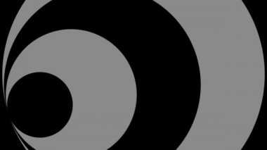 Siyah-beyaz, saat yönünde dönen, tam ekran boyutunu 16: 9 video biçiminde ortadan kaybolmaya indirgeyen, stroboskopik ve hipnotik efektli grafiksel nesne.
