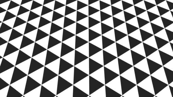 Grafický vzor v černé a bílé, který se naklání nahoru a pohybuje, složený z geometrických tvarů ve formátu 16: 9
