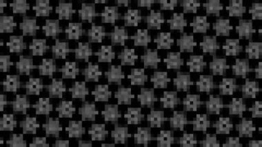 Abstract animation in black and white on a minimal background with mosaic effect, which rotates, varies in size, angle and intensity, in 16: 9 video format