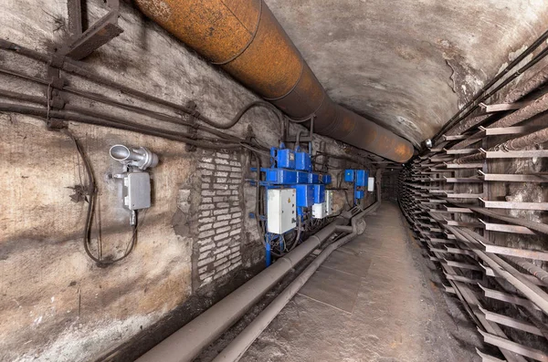 Electrical cabinets and other equipment in underground communication tunnel
