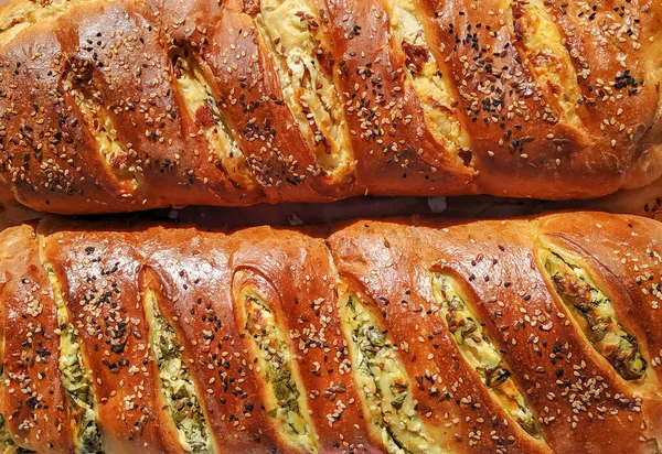 Beautiful delicious looking stuffed pastry bread decorated with seeds, cooked homemade for healthy nutritious meal or snack — ストック写真