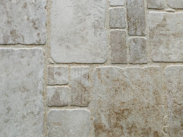 Briques ou carreaux abstraits modernes décoratifs pour revêtements de sol ou façades en blocs de pierre de texture brute solide — Photo