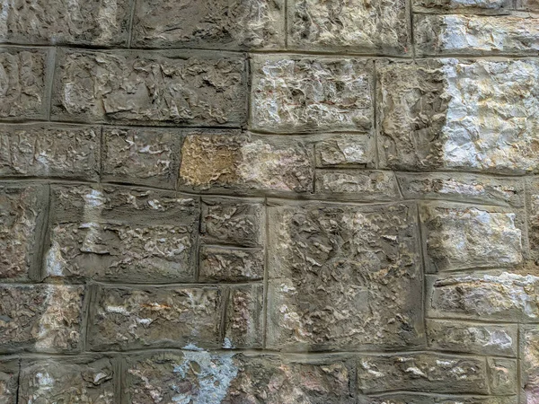 Старий вигляд кам'яних каменів стіна або підлога з цегляною плиткою, укладеною один на одного цементом та іншим грубим матеріалом, професійні шпалери для кладки фону — стокове фото