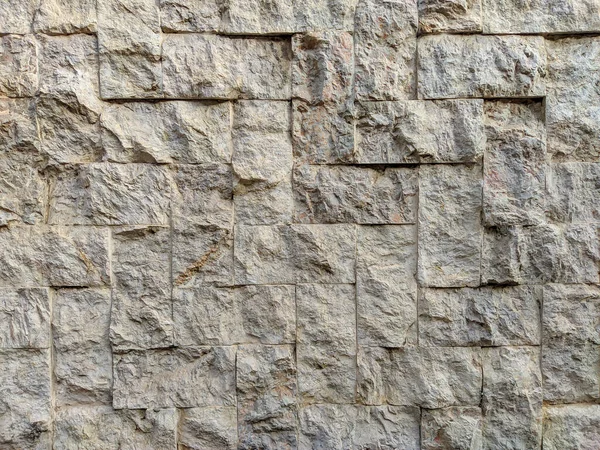 Modern and good looking white stone rock bricks on an outside wall as interesting decoration style — Stock Photo, Image