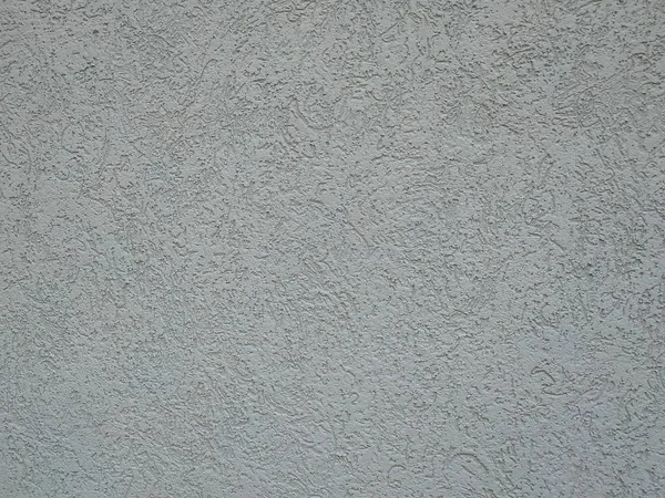 Pared gris simple de un edificio en el interior o en el exterior con textura áspera y patrón visible del cemento grueso — Foto de Stock