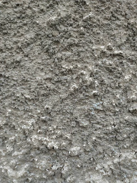Bardzo szorstka tekstura starej brązowo-szarej tradycyjnej ściany z widocznym wzorem nakładania cementu i innych materiałów tapety — Zdjęcie stockowe