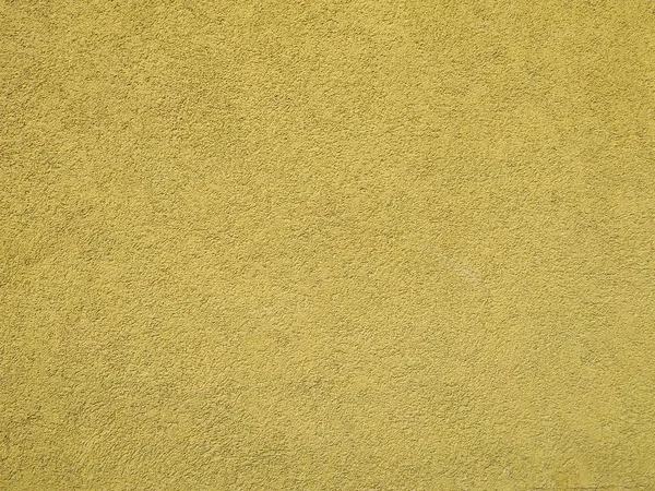 Gładka żółta ściana budynku z widocznym wzorem tekstury ściany zewnętrznej lub wewnętrznej budynku chłodnego pustej tapety lub tła — Zdjęcie stockowe