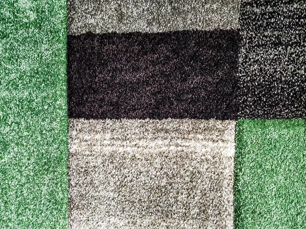 Modern and abstract colorful grey, black and green woolen fluffy carpet used for interior decoration, a sample at a store and a wallpaper — 스톡 사진