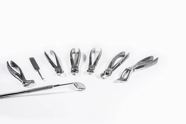 Dental Instruments arranged on white table. — Stock Photo, Image