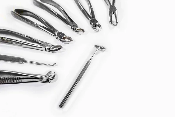 Dental Instruments arranged on white table. — Stock Photo, Image