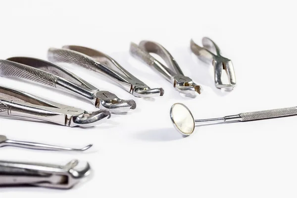 Dental Instruments arranged on white table. — Stock Photo, Image