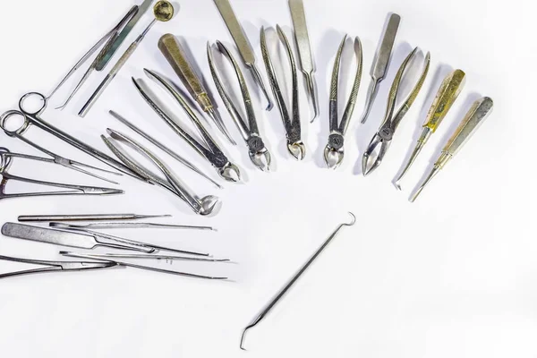 Dental Instruments arranged on white table. — Stock Photo, Image