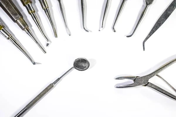 Dental Instruments arranged on white table. — Stock Photo, Image