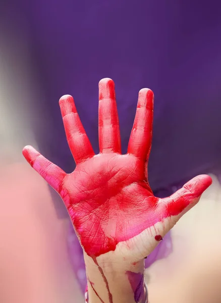 Red hand of the Color of Holi the Indian celebration.