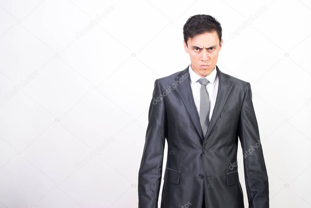 Challenging man in suit. White background. Middle plane