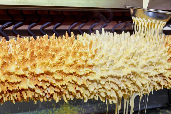 Cooking Traditional Lithuanian cake on skewer, selective focus in motion — Stock Photo, Image