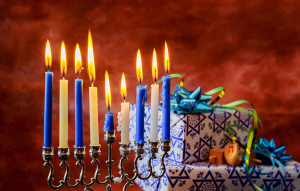 Jewish Holiday Hanukkah holiday with menorah burning candles.