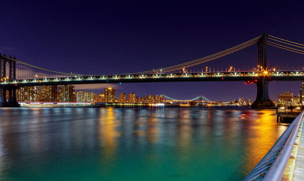 Panorama of Manhattan Bridge in New York City at night Brooklyn and Manhattan and Williamsburg bridges span across the East River