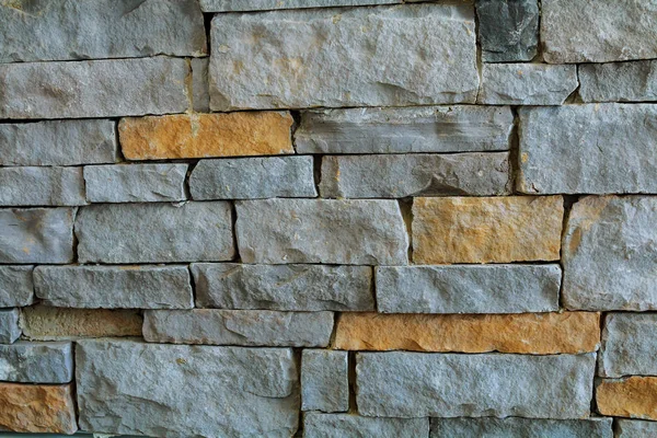 Old long narrow worn down bricks make a wall., — Stock Photo, Image