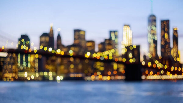 Defocused view of the New York skyline from Brooklyn Bridge Park