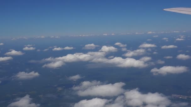 Traveling by air above clouds. View through an airplane window. Flying over the Mediterranean — Stock Video