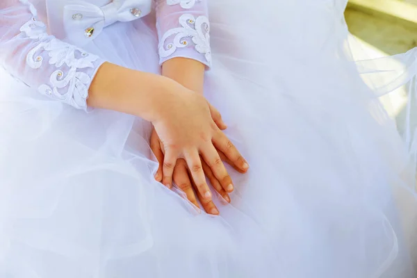 Child hands white dress — Stock Photo, Image