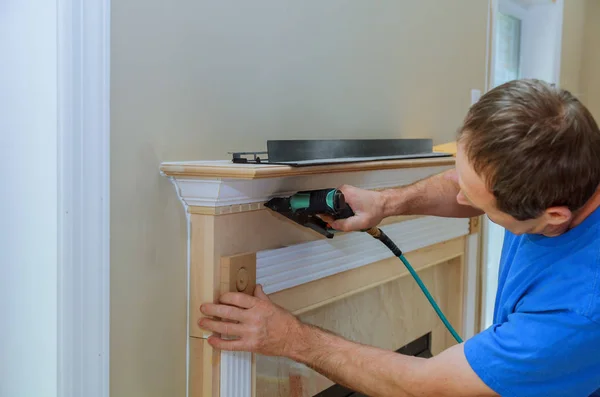 Handyman nailed up Moulding Accents in the new house — Stock Photo, Image