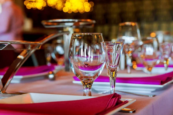 Served for a banquet catering table with wine glasses and plates — Stock Photo, Image