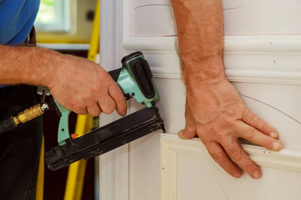 Home Improvement Carpenter Brad Using Nail Gun Moulding — Stock Photo, Image