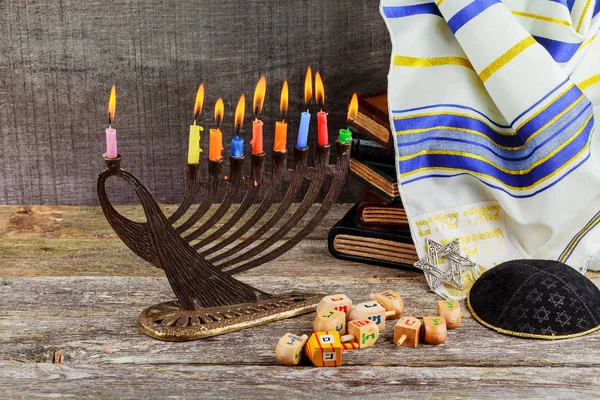 Low key Image of jewish holiday Hanukkah background with menorah traditional candelabra and burning candles — Stock Photo, Image