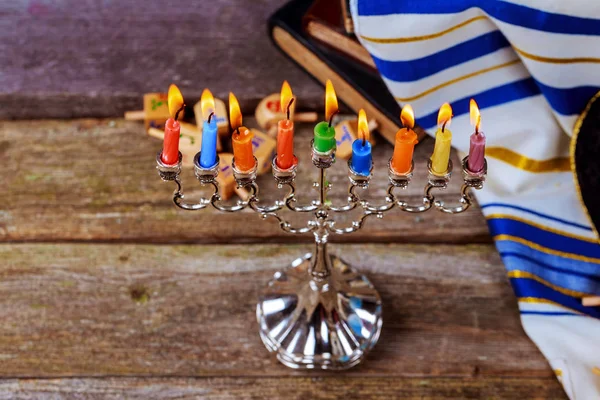 Prayer shawl, jewish cap and nine candle menorah — Stock Photo, Image
