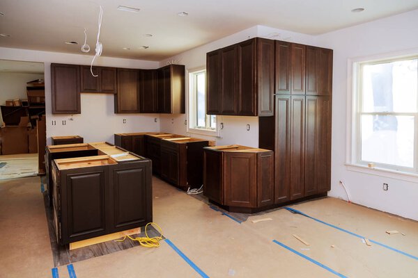 Custom kitchen cabinets of installation base for island in center