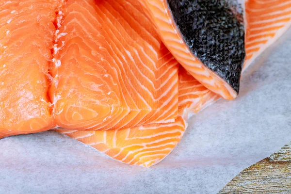 Fresh salmon on the wood cutting board. Delicious salmon steak with fresh