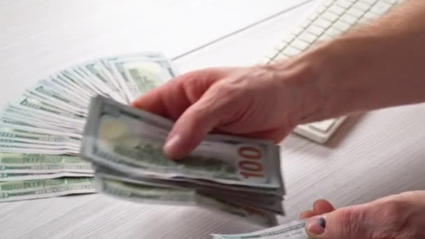 A Close up of male hands counting US dollar banknotes man is counting the US money — Stock Video