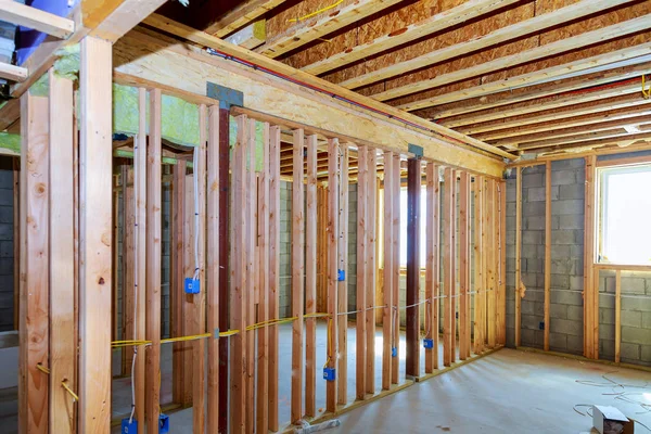 Frame of a wall and a ceiling of a wooden house, vapor barrier, partially sheathed walls — Stock Photo, Image