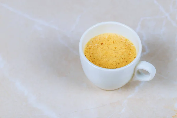 Cup of coffee on marble table — Stock Photo, Image