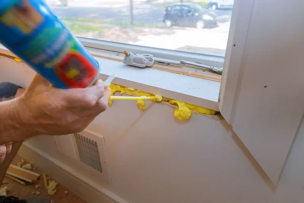 Construction PU foam in the window installed using a mounting installation foam — Stock Photo, Image