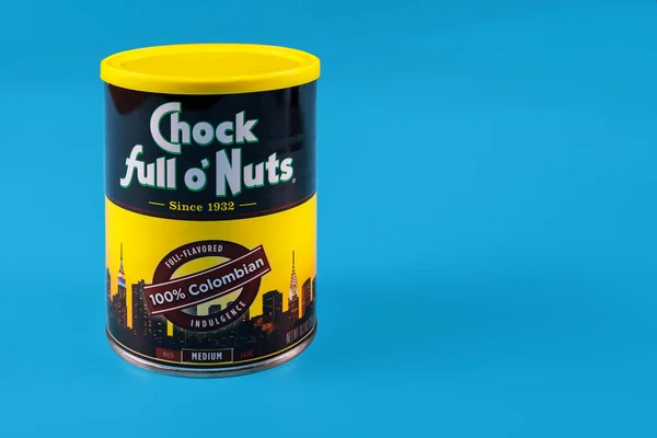 Chock full o Nuts, metal box can for coffee packaging on a isolated against a blue background — Stockfoto