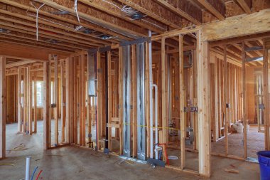 A new home under construction interior inside house frame. clipart