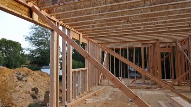 Interior of a new home wooden beams at construction residential house framing — Stock Footage Interior of a new home wooden beams at construction residential house framing Stock Footage