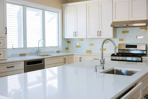 Repairing sink pipe in the kitchen plumber with island sink