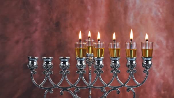 Fifth day Hanukkah candles are burning on light of the Jewish holiday — Stock Video