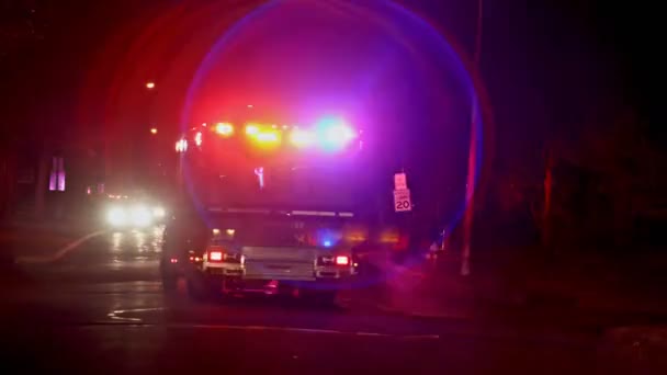 View of rear flashing lights of emergency service ambulance at nighttime Ambulances in front — 图库视频影像