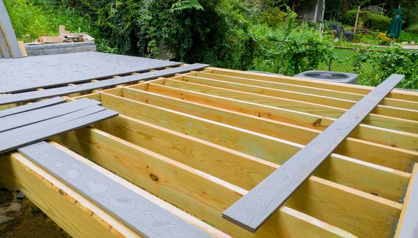 Installing deck boards with above ground deck, patio construction. — Stock Photo, Image