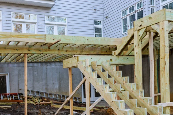 Unfinished installation deck patio construction of flooring by house — Stock Photo, Image