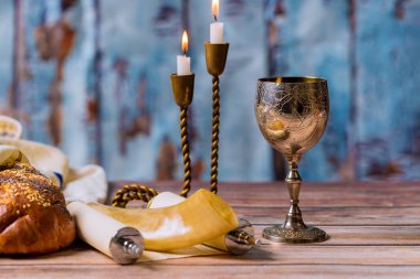 Shabbat eve table challah bread and candelas with kidush wine clipart