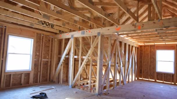 Beam built home under construction with wooden truss, post and beam framework. — Stock Video