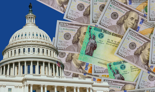 Washington DC Capitol dome with finishing touches on a stimulus bill Global pandemic Covid 19 lockdown US dollar cash banknote on American flag