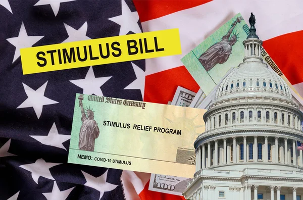 Economic U.S. STIMULUS RELIEF PROGRAM Bill Coronavirus Global pandemic Covid 19 financial lockdown from government US 100 dollar bills currency on American flag